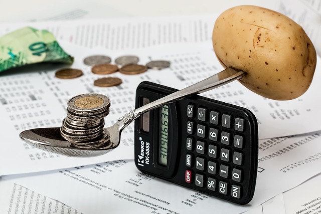 Calculator and coins representing budgeting