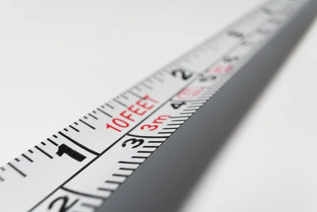 Measuring tape with millimetre, centimetre and inch markings